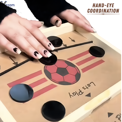Hands controlling string hockey game board showing hand-eye coordination development through interactive gameplay
